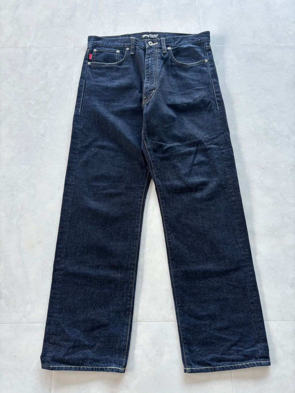 STUSSY Back Paint Logo Jeans