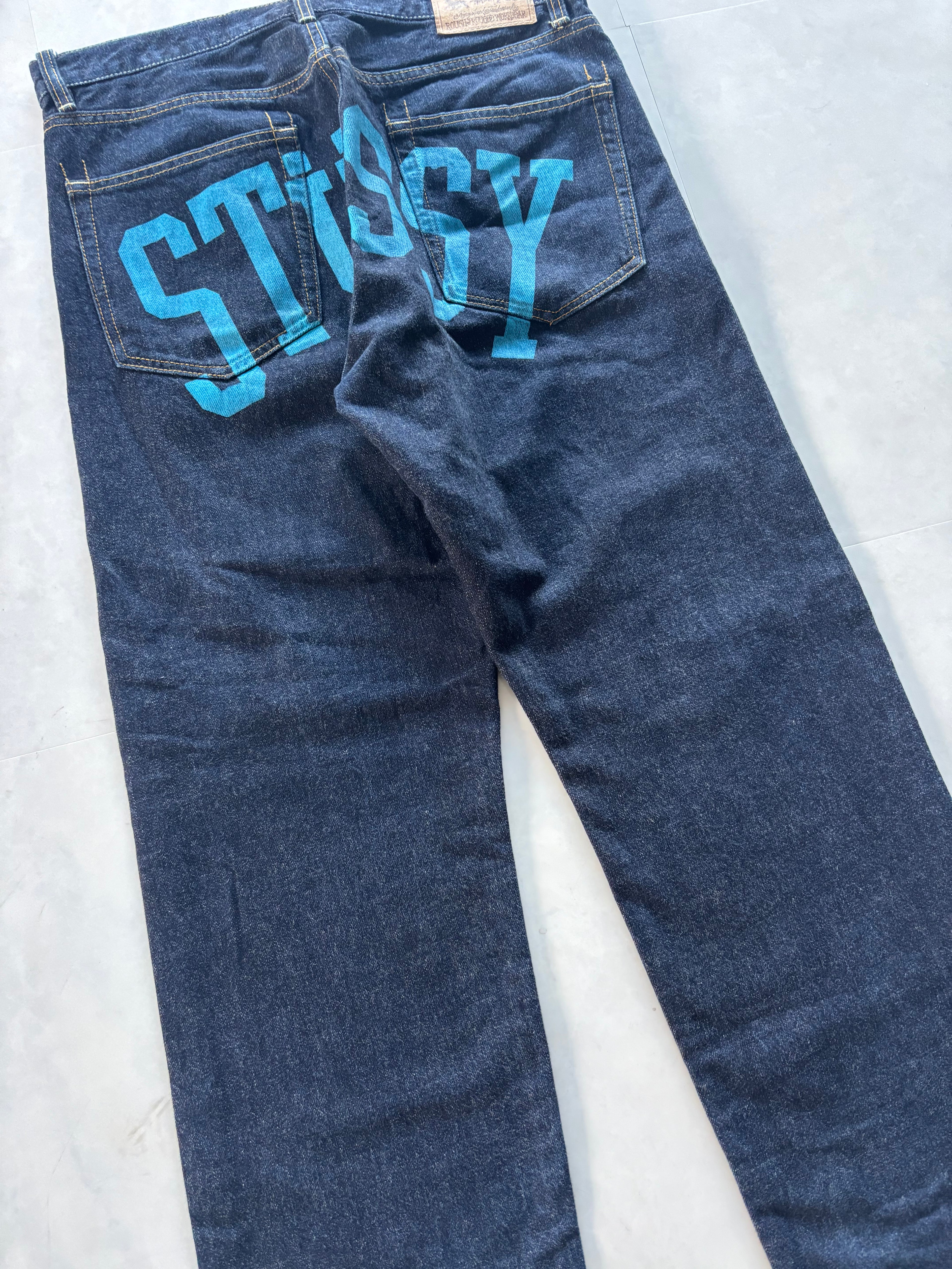 STUSSY Back Paint Logo Jeans