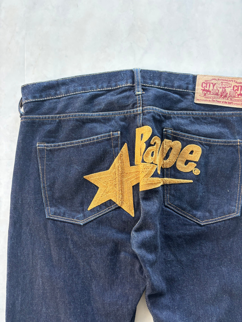 A BATHING APE Gold Star Logo Denim