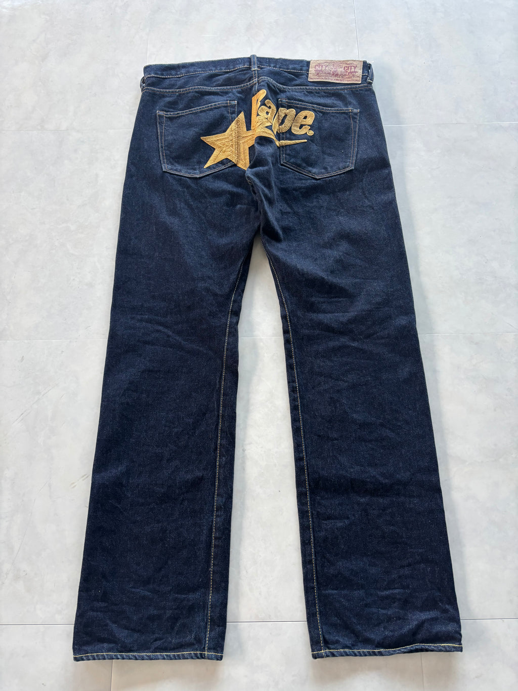 A BATHING APE Gold Star Logo Denim
