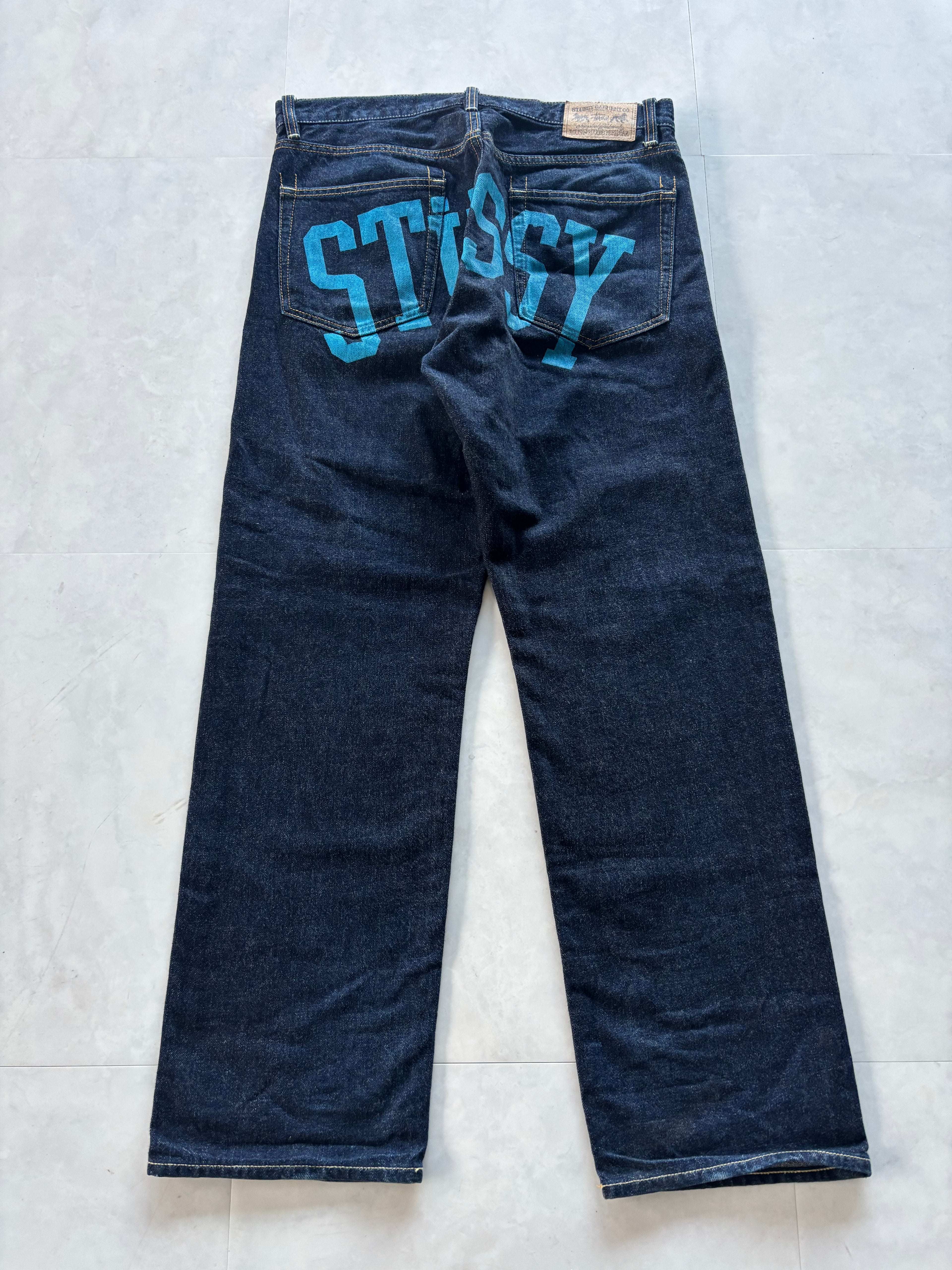 STUSSY Back Paint Logo Jeans