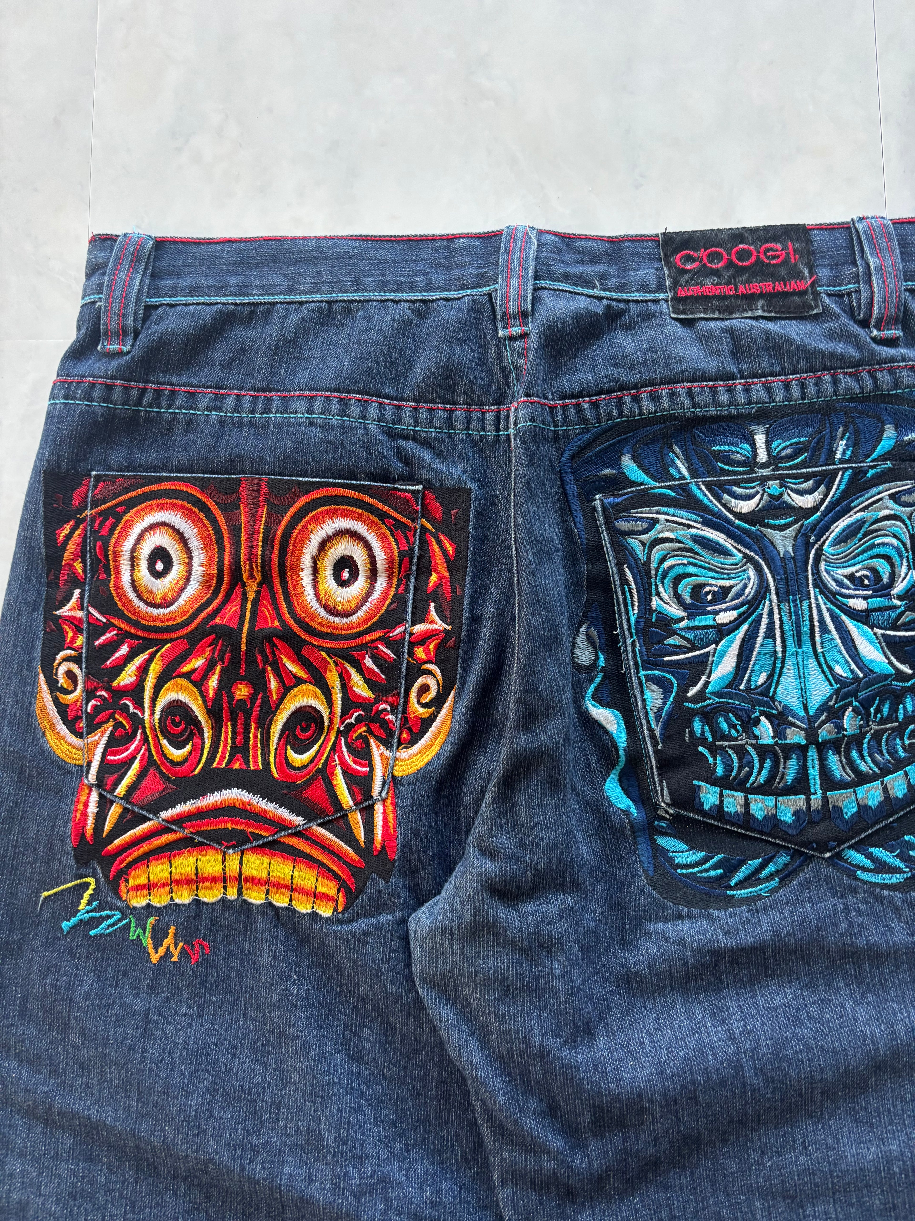 COOGI Tribal Mask Embroidery Denim